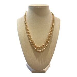 Vintage Champagne graduated pearls on string marked 10k white gold clasp. JB1
